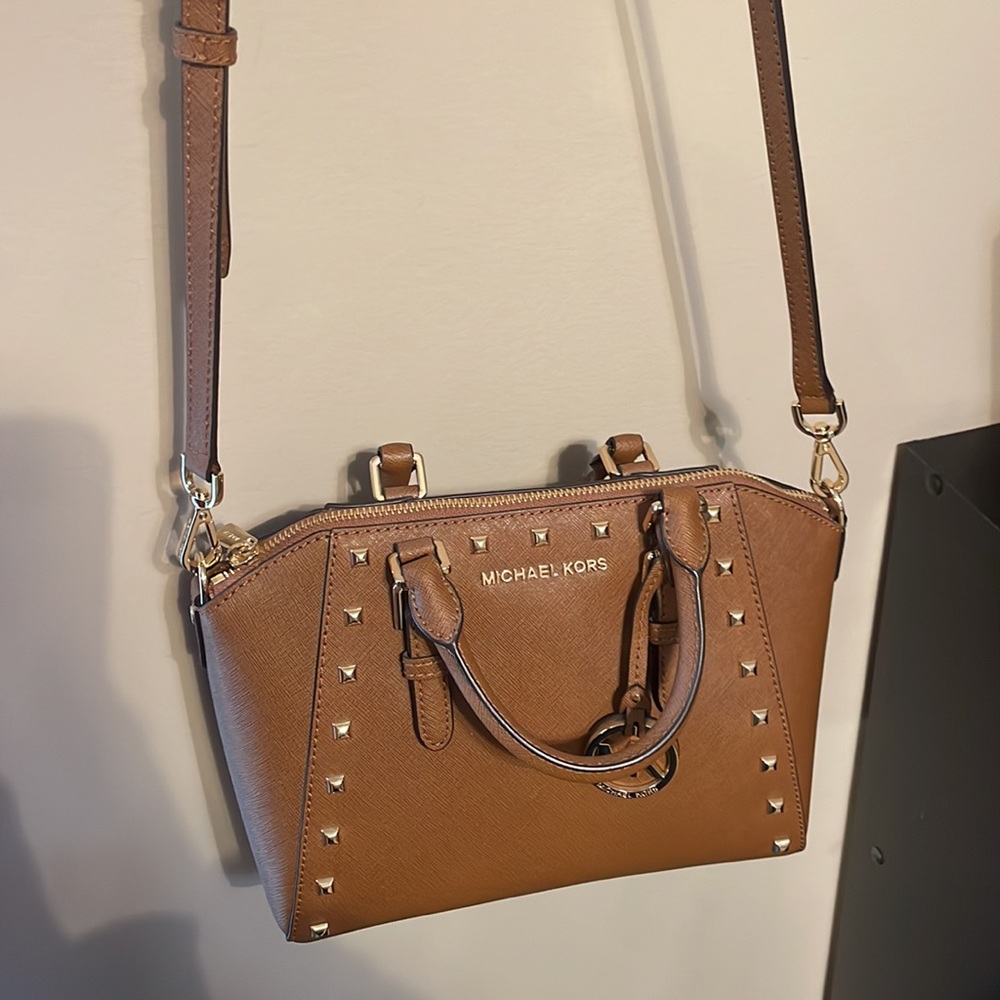 Tan Michael Kors crossbody purse with gold studs